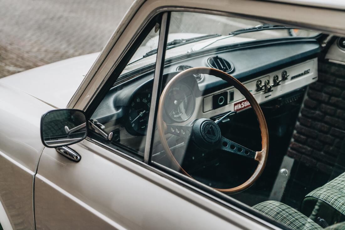 Classic car showing off its side mirror and side windows
